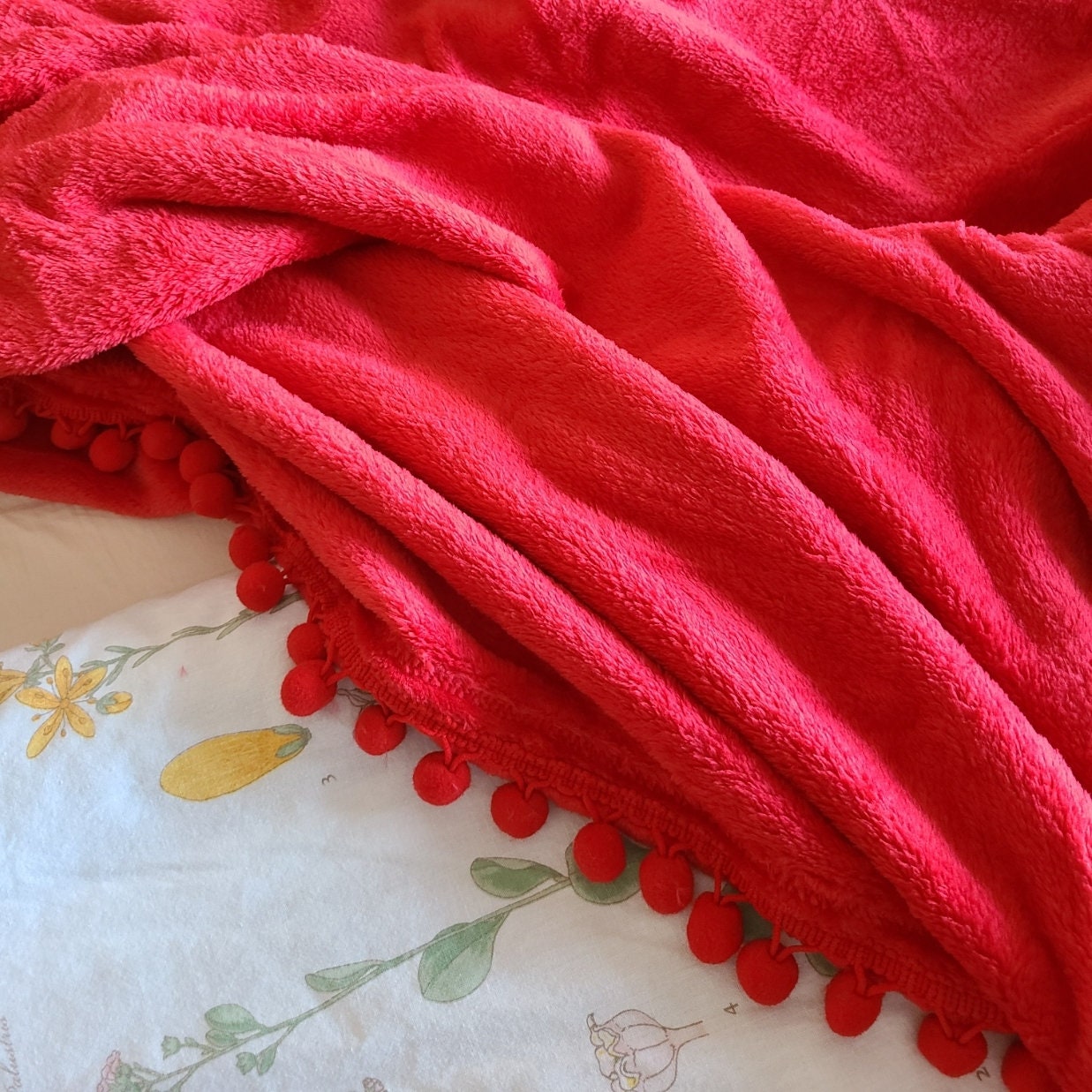 Red pom pom discount throw